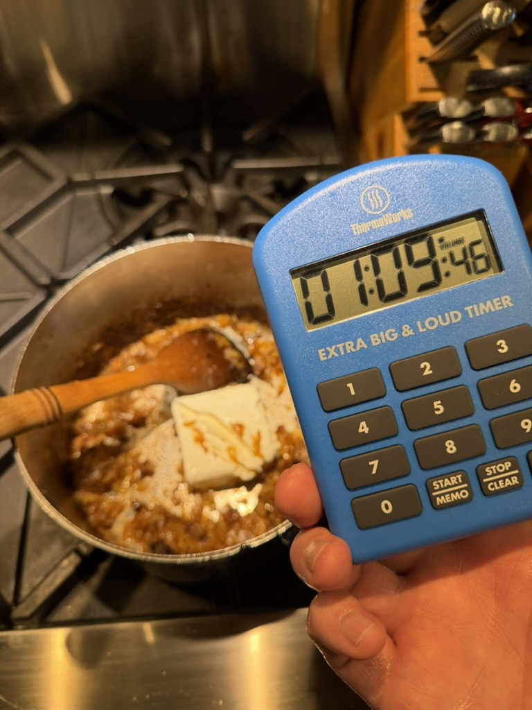 Cream cheese melting into caramelized onions after over an hour of cooking